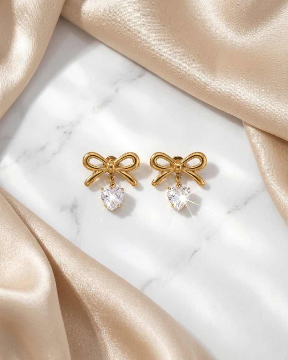 Elegant Gold Bow Earrings – Heart Charm Detail