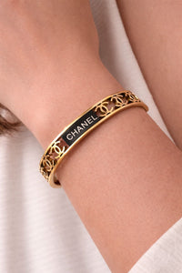 Classic Gold-Finish Stainless Steel Bangle with Signature Pattern