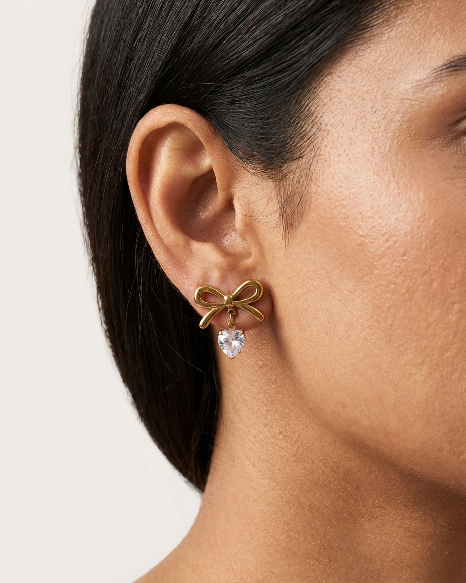 Elegant Gold Bow Earrings – Heart Charm Detail