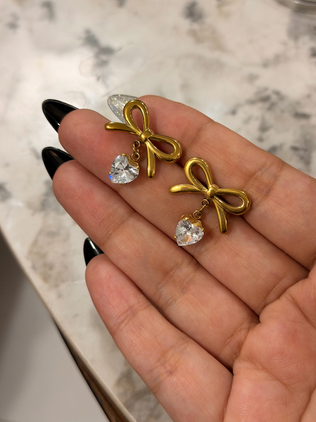 Elegant Gold Bow Earrings – Heart Charm Detail