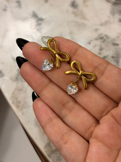 Elegant Gold Bow Earrings – Heart Charm Detail