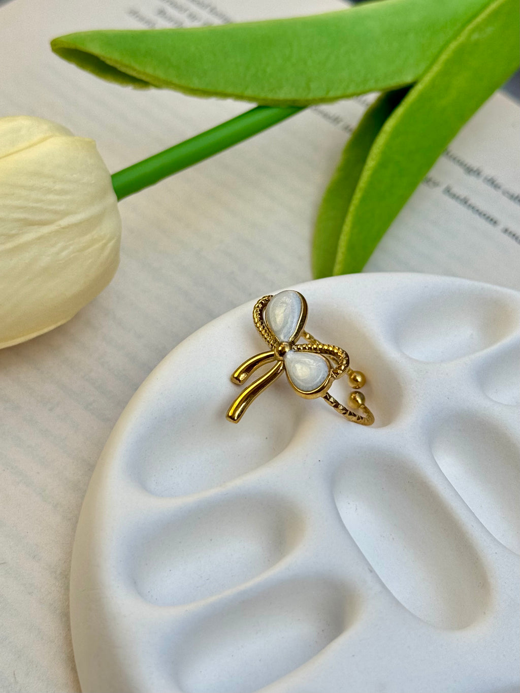 Elegant Bow Gold Ring with Pearl Detailing