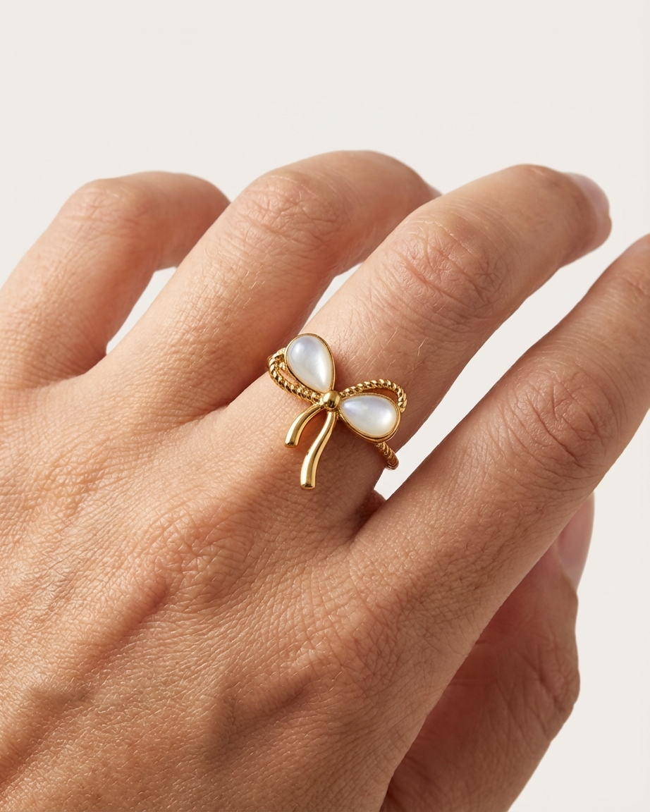 Elegant Bow Gold Ring with Pearl Detailing